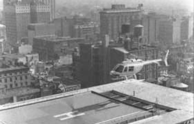 A helicopter prepares to land on the rooftop of Foerderer Pavilion.