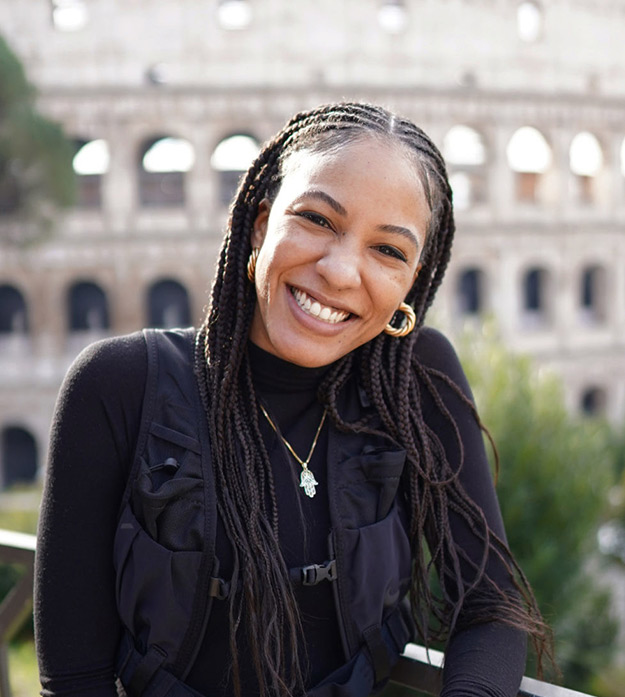 Class of 2014 alumna Natasha A. Trice poses in front of the Roman Colosseum.
