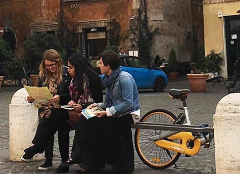Students in a study abroad program taking a break to explore the city.